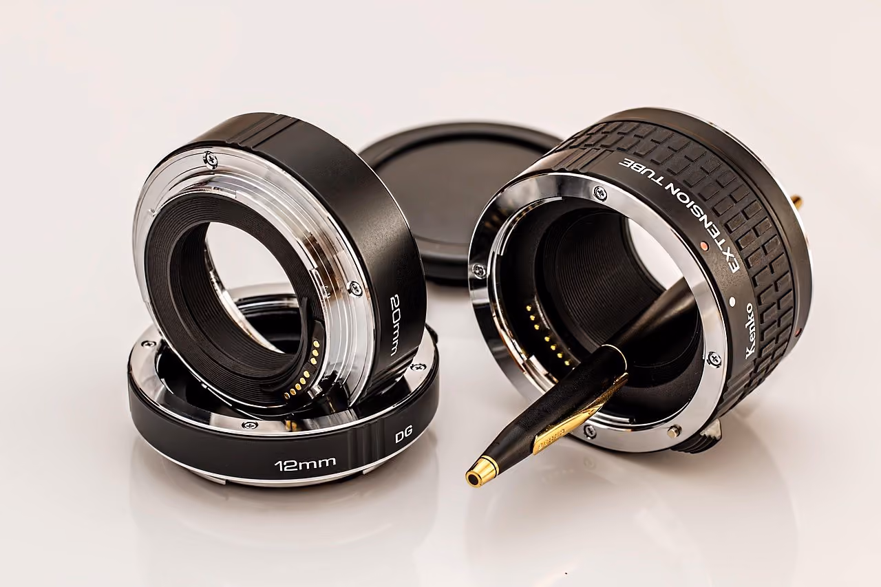 After: Set of black camera lens extension rings on a light surface